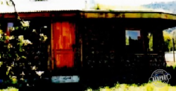 PARCELA CON CASA DE VERANEO