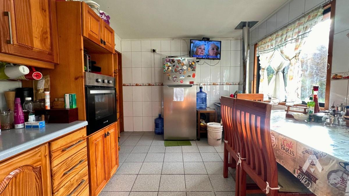 Parcela con casa y cabañas en venta en Villarrica